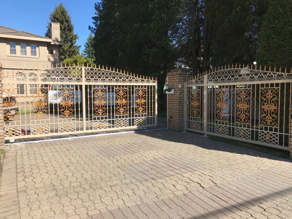 Ornamental sliding driveway gate with a matching pedestrian gate