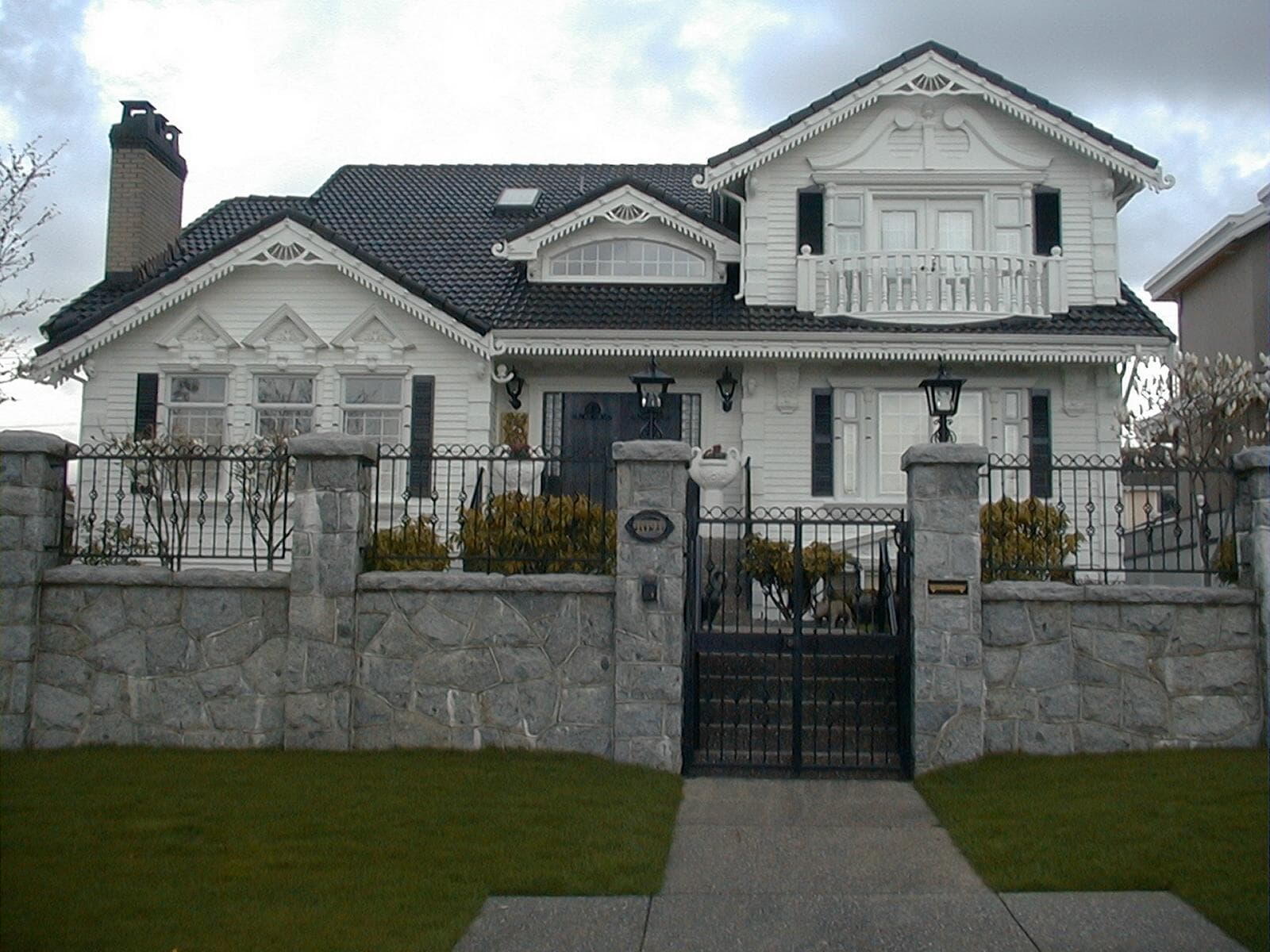 Ornamental pedestrian gate, front fence, and balcony railing
